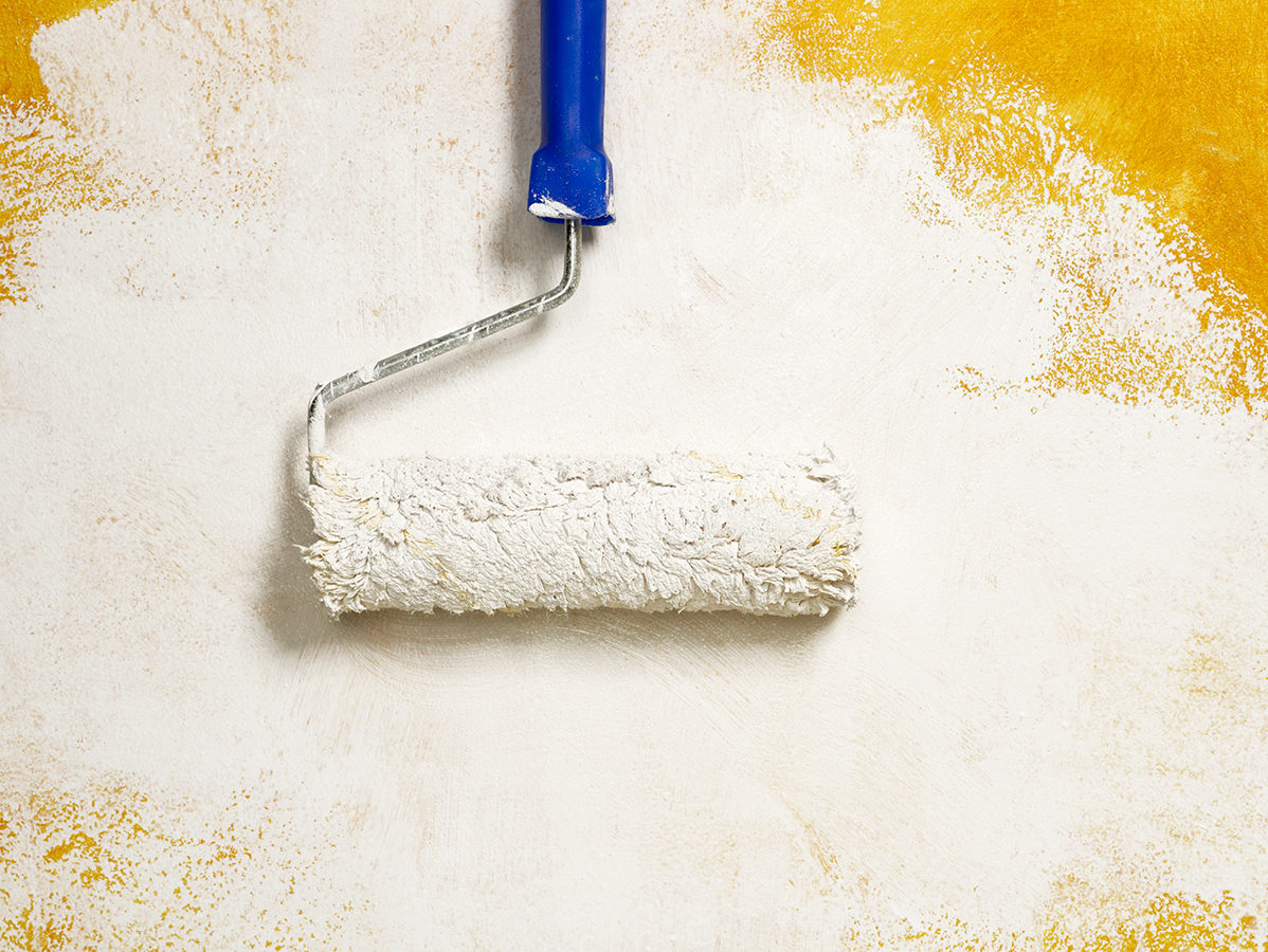 paint roller on a wall