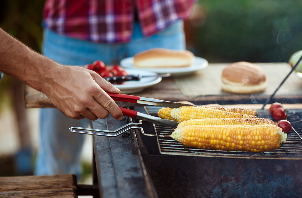 Corn grilling on grill outside