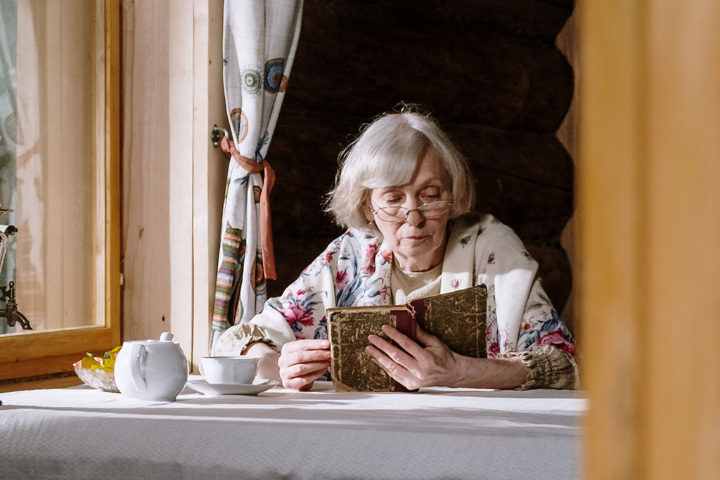 Older woman reading book