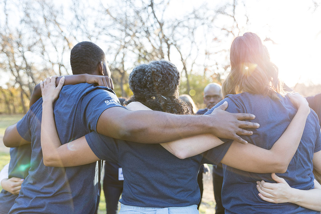 Volunteers doing a group hug