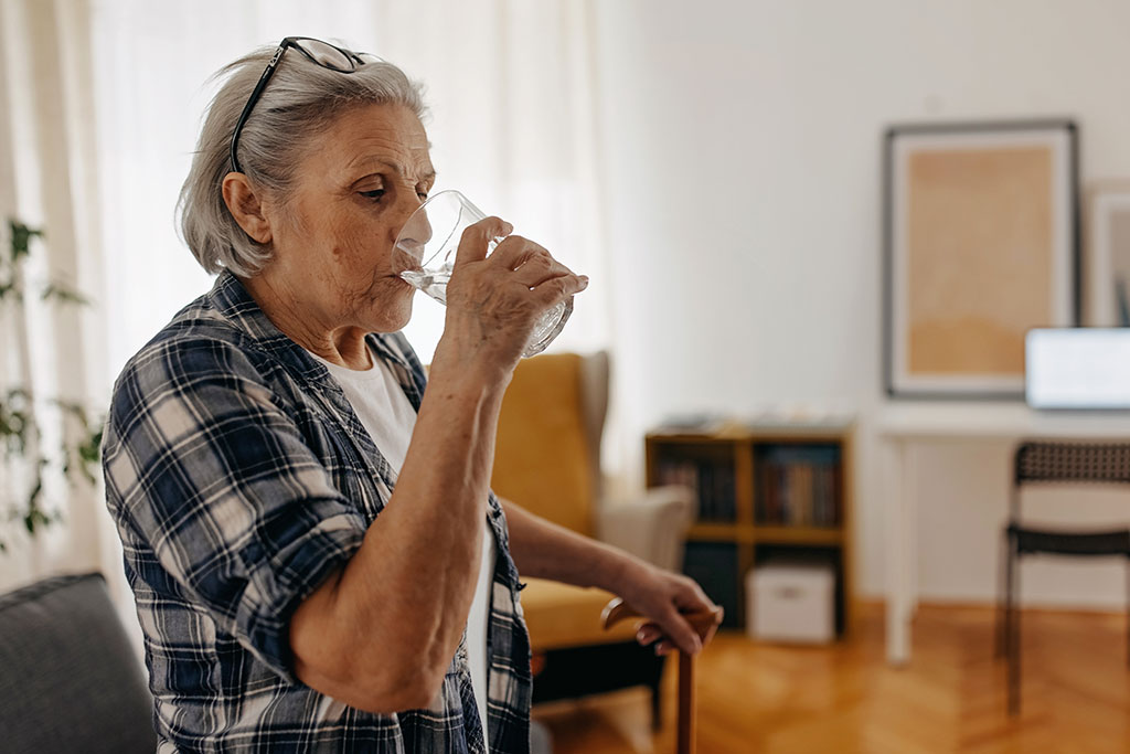 Older lady drinking water