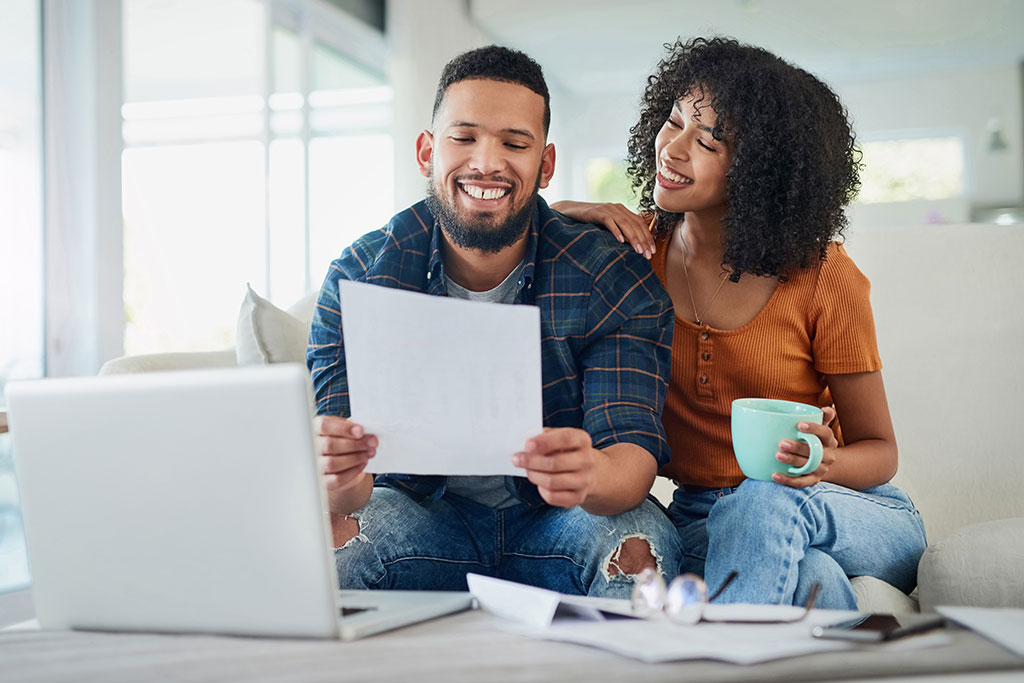 Young couple looking over finances