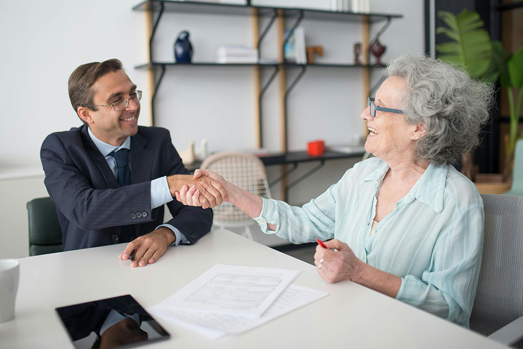 Older woman talking with advisor