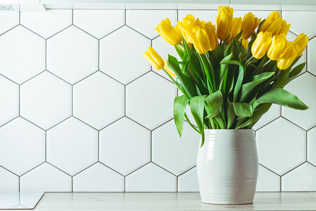 Vase with yellow tulips