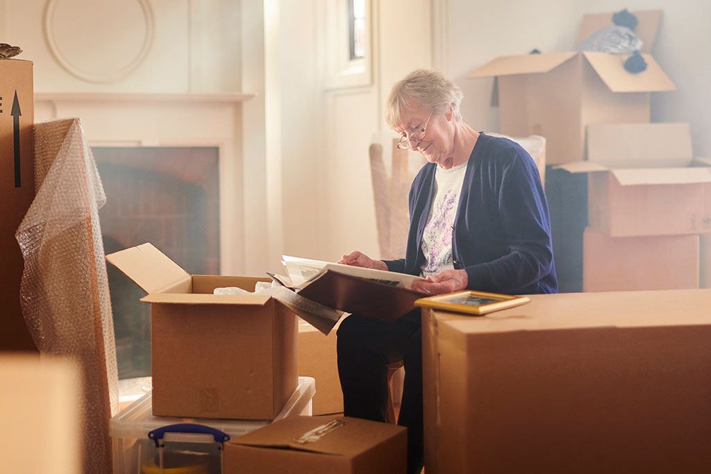 Older woman packing house