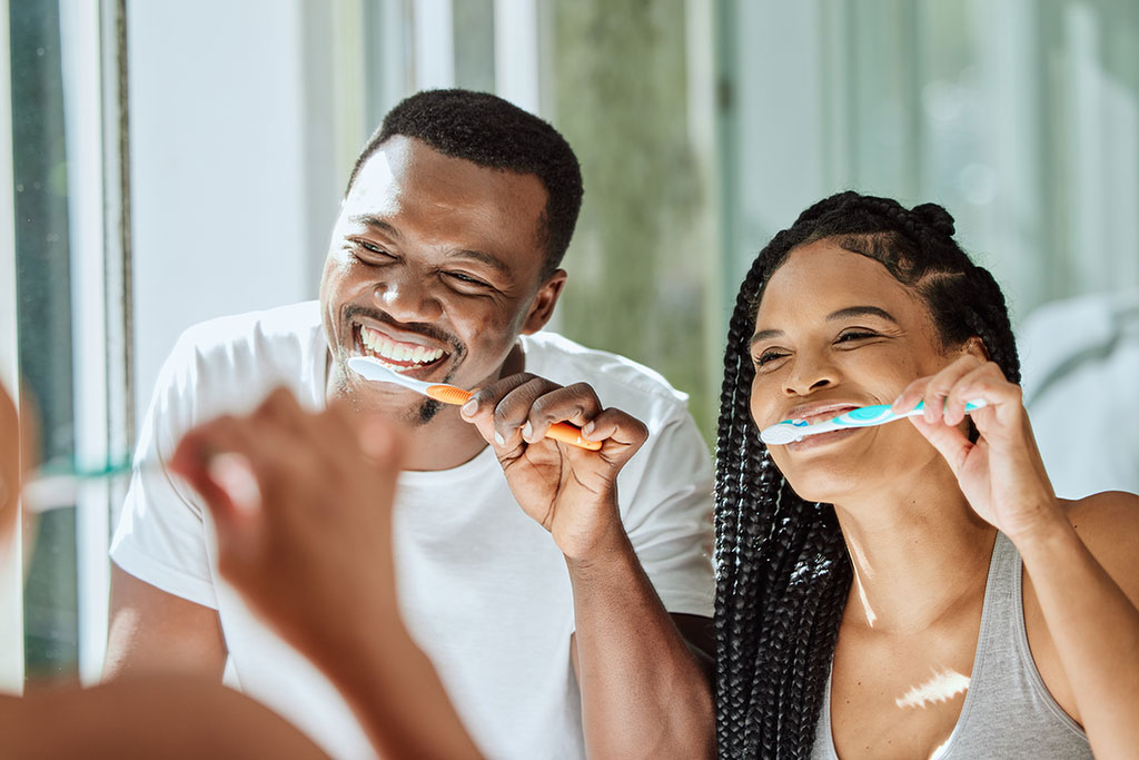 Couple brushing teeth in the morning