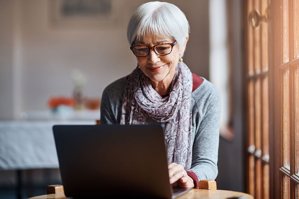 Older woman using laptop