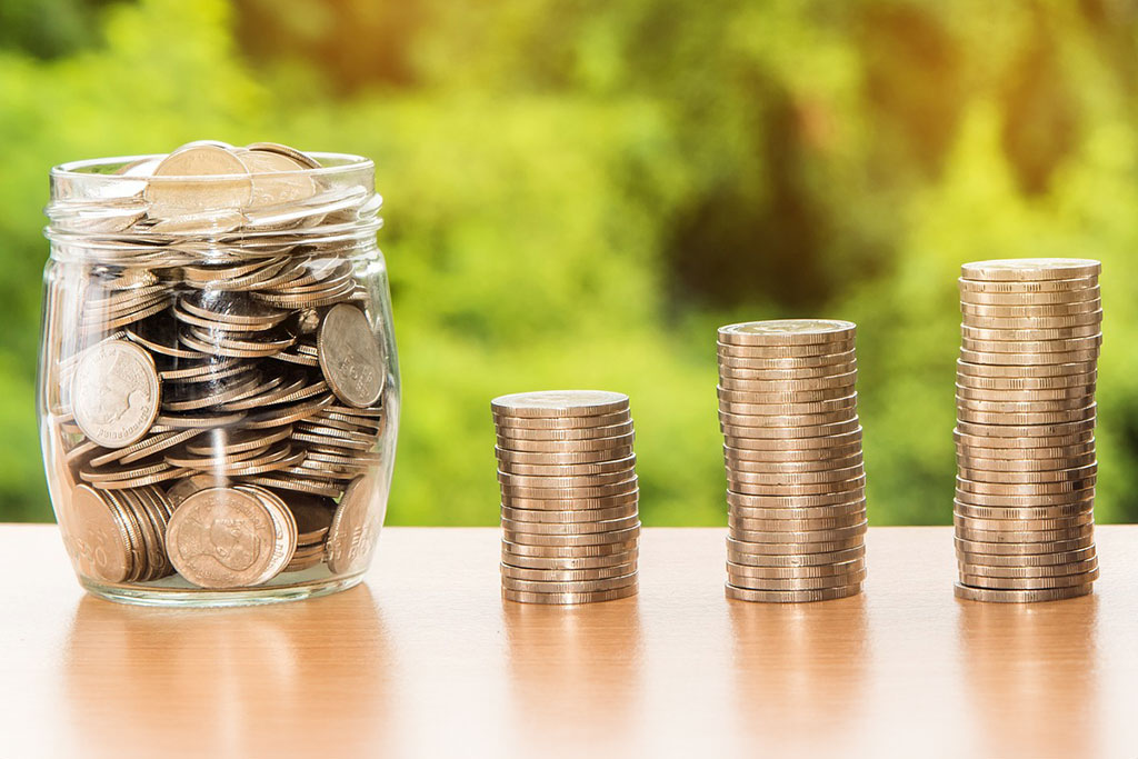 Coins stacked and in jar