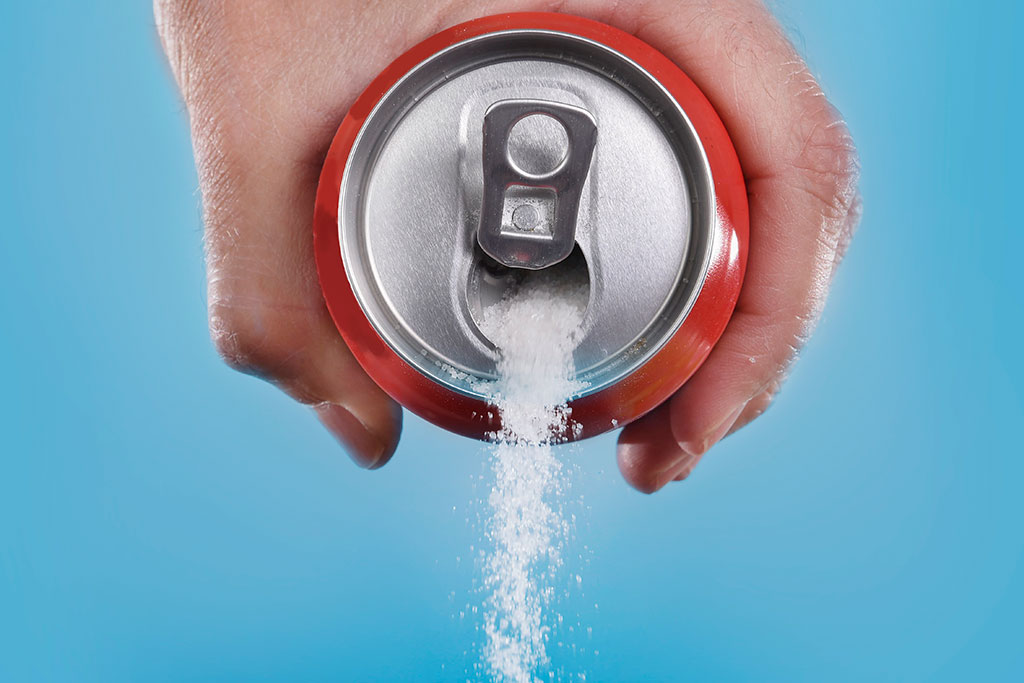 Sugar pouring out of soda can