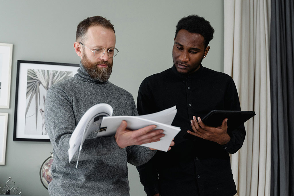 Men looking over papers