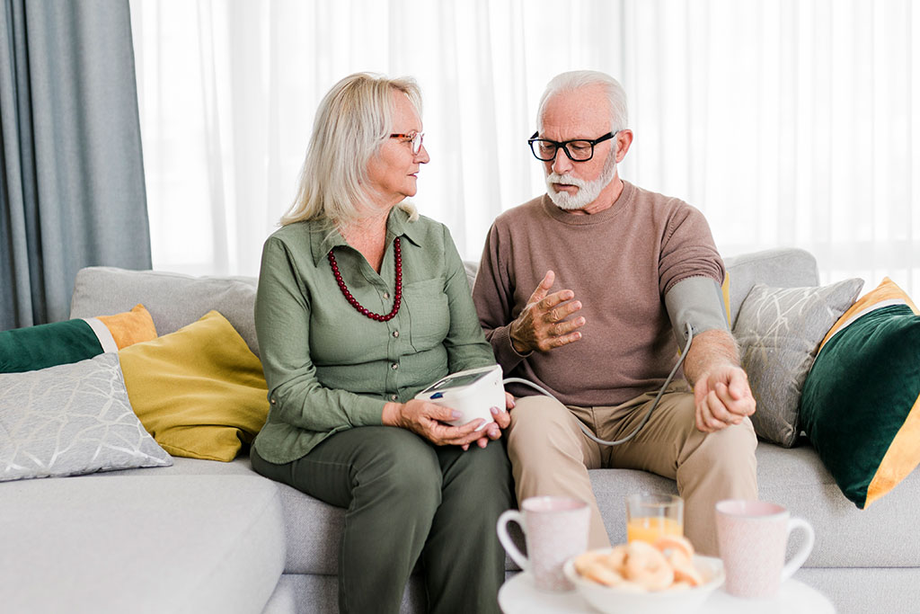 Older couple checking blood pressure