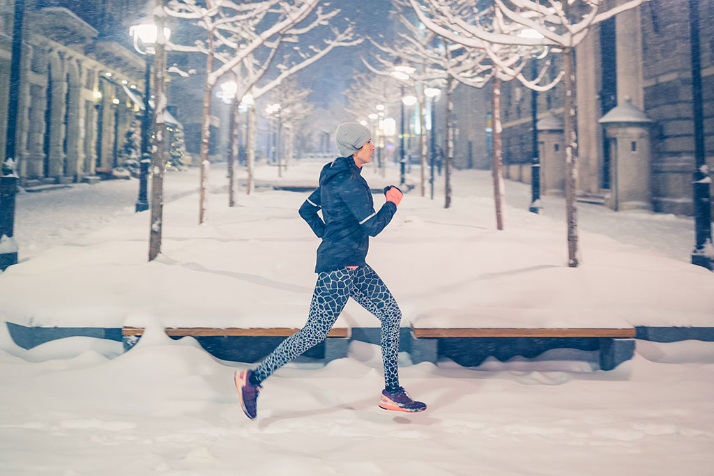 Person running outside in snow