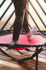 Person exercising on mini trampoline