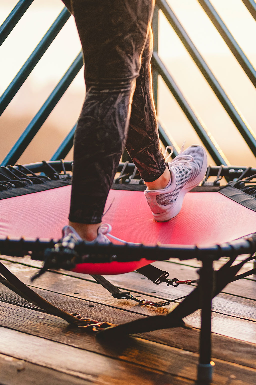 Person exercising on mini trampoline