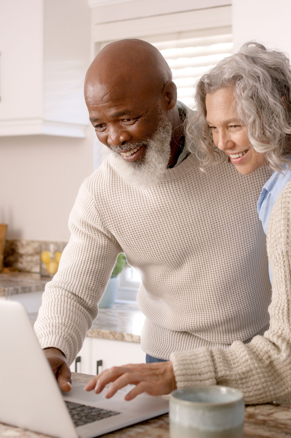 Older couple looking at laptop