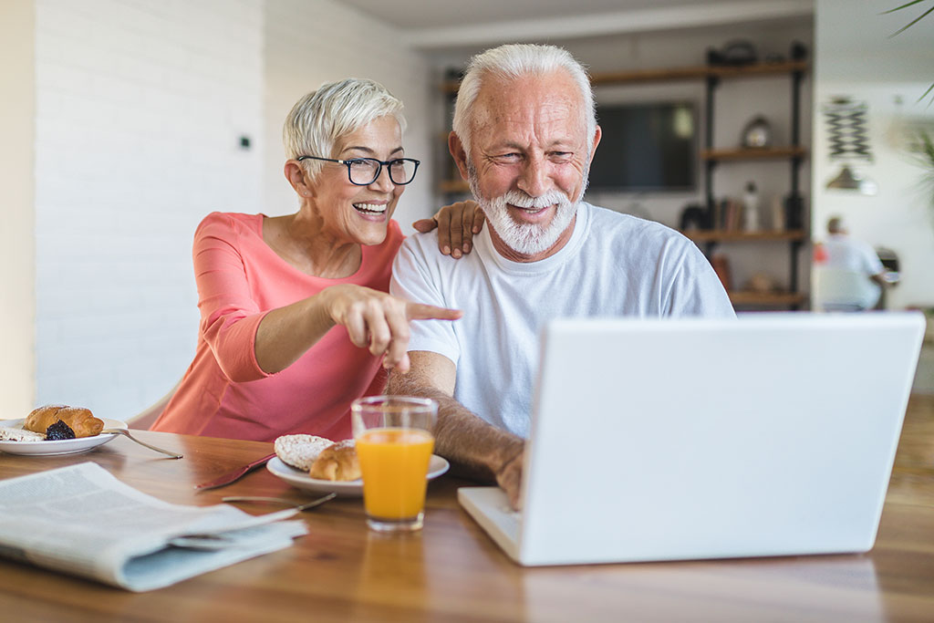 Older couple looking at laptop