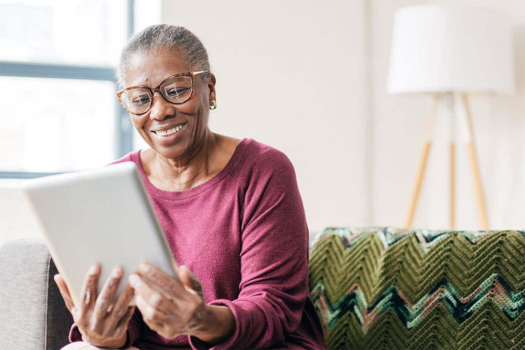 Older woman looking at tablet