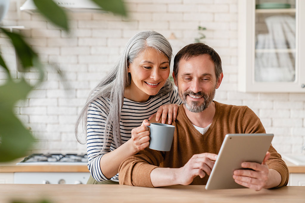 Older couple looking at tablet