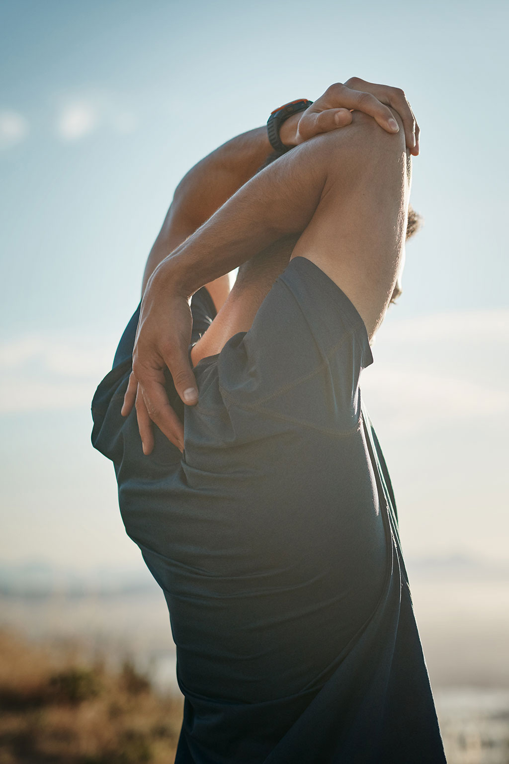 Man stretching outside