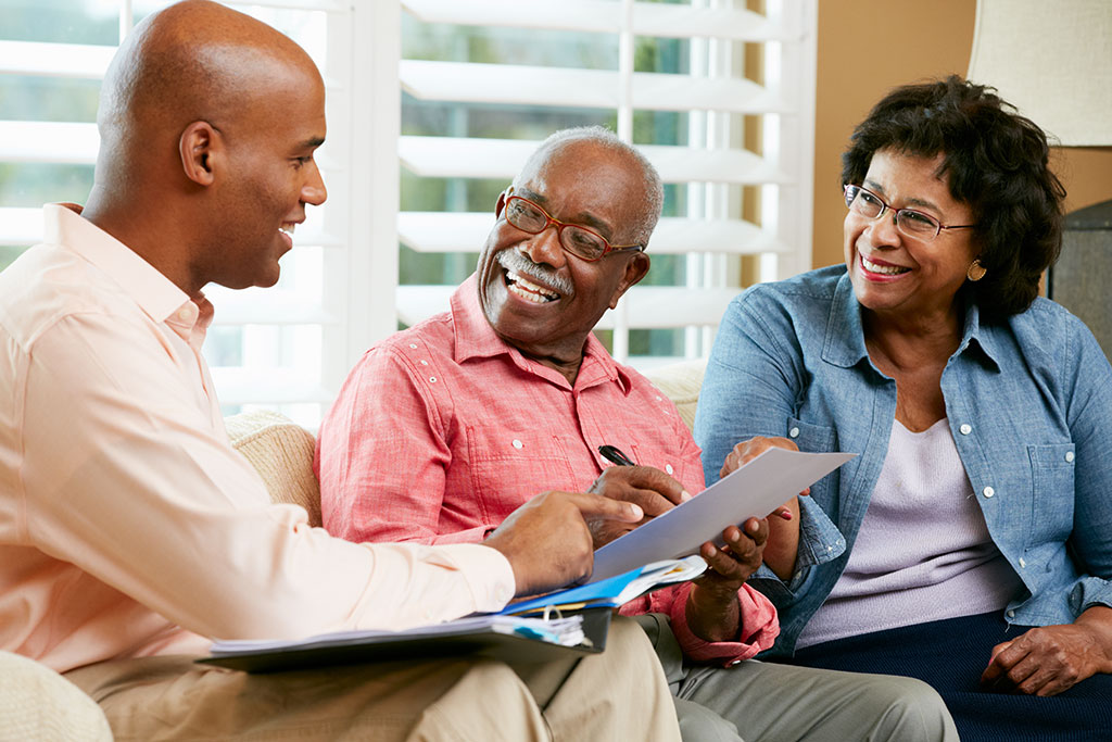 Older couple talking to advisor