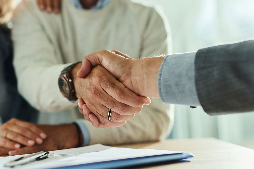 Client shaking hands with advisor