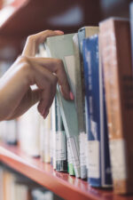 Choosing a book from a shelf