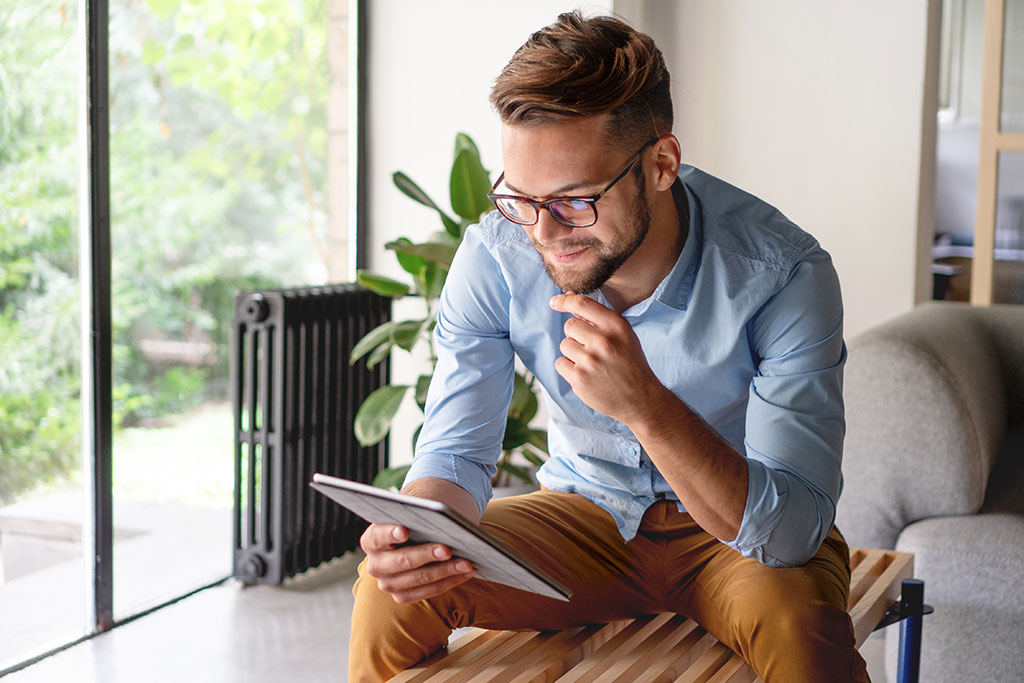 Man reading book on tablet