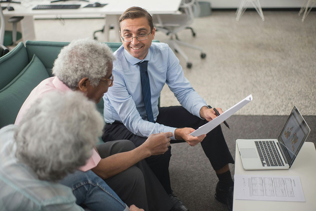 Older couple meeting with financial advisor
