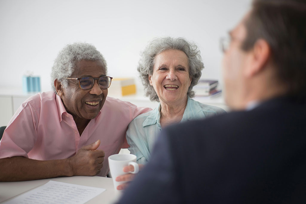 Older couple talking to advisor