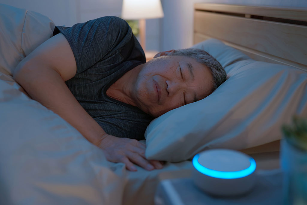 Man sleeping with sound machine