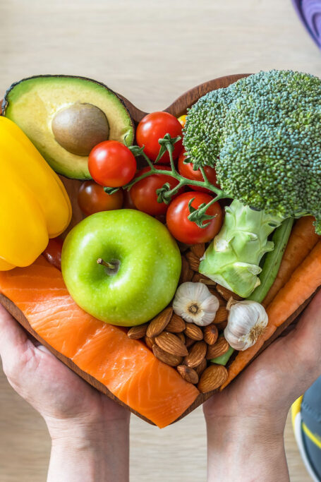 Healthy food for your heart on tray person is holding