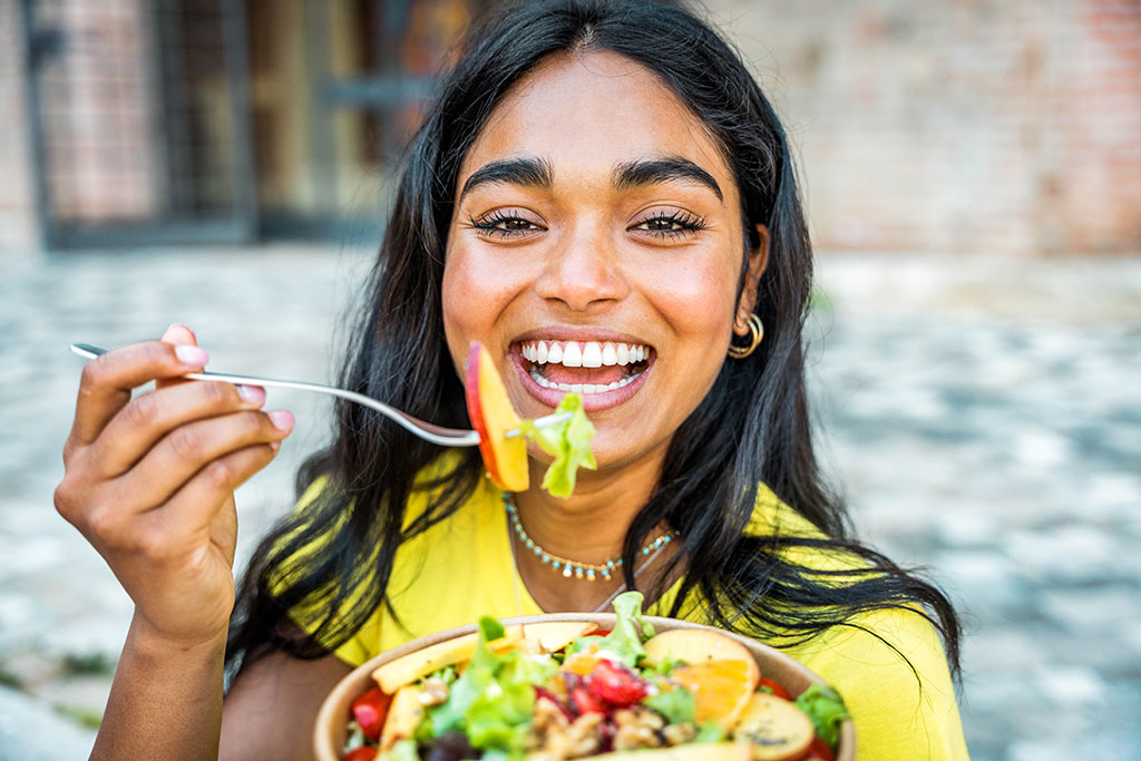 Woman eating salad
