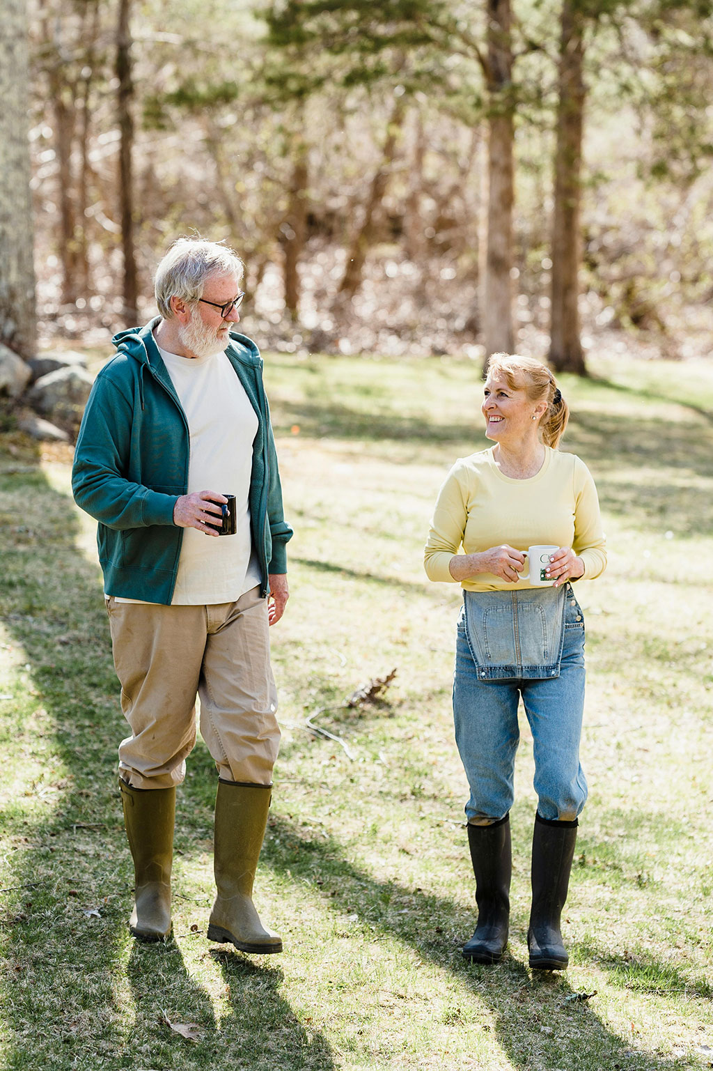 Retired couple walking and drinking a cup of coffe