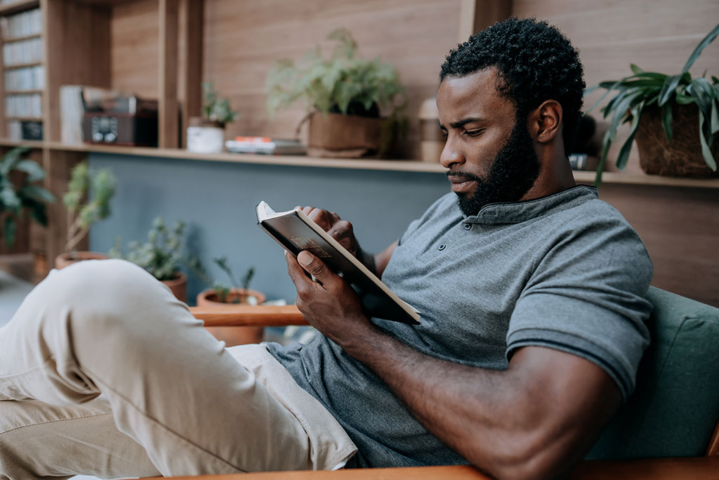 Man looking at journal