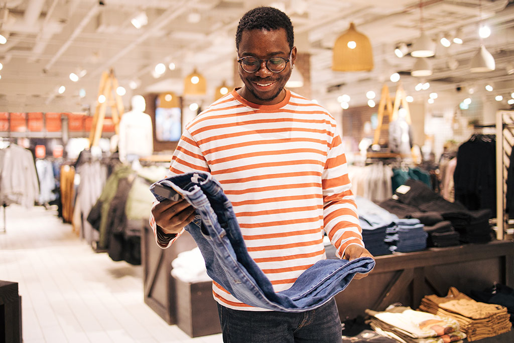 Man looking at clothes in store