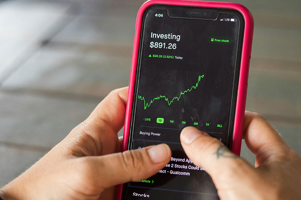 Person looking at their investments on phone